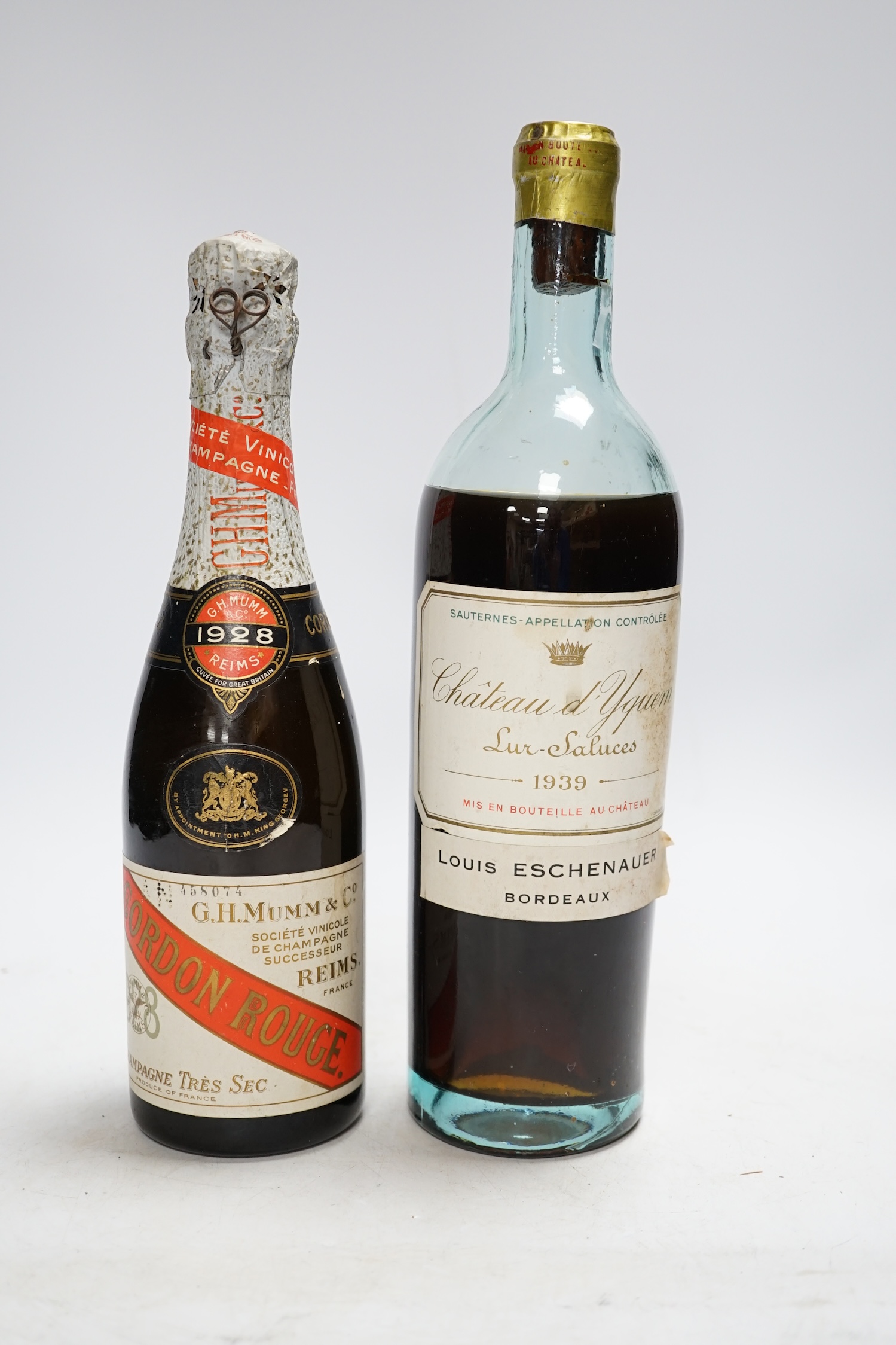 One bottle of Chateau d'Yquem 1939 and one half bottle of G.H. Mumm & Co 1928 Champagne