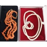 Two coral necklaces, one with beads the other branches, 33cm and a double strand cultured pearl