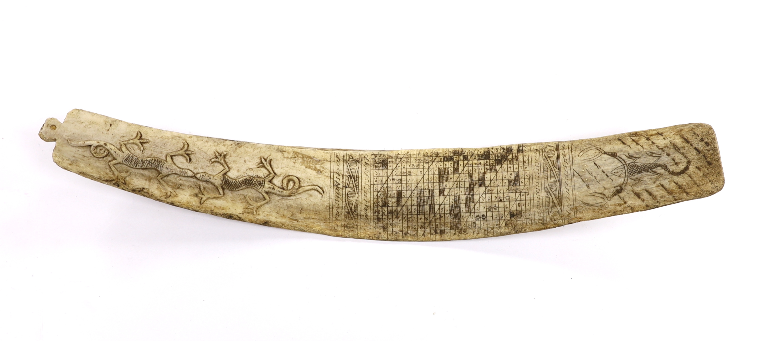 A late 19th/early 20th century Indonesian, Sumatran, carved buffalo rib calendar, Batak, 37cm