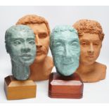 Four art pottery sculpted heads on stands, two terracotta and two painted verdigris green, largest