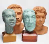Four art pottery sculpted heads on stands, two terracotta and two painted verdigris green, largest