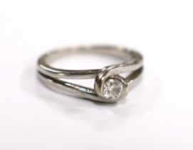 A 9ct white gold and solitaire stone diamond set ring, the stone weighing approx. 0.15cts, size L/M,