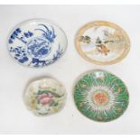 Four Chinese or Japanese porcelain saucers, largest 16.5 cm diameter