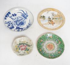Four Chinese or Japanese porcelain saucers, largest 16.5 cm diameter