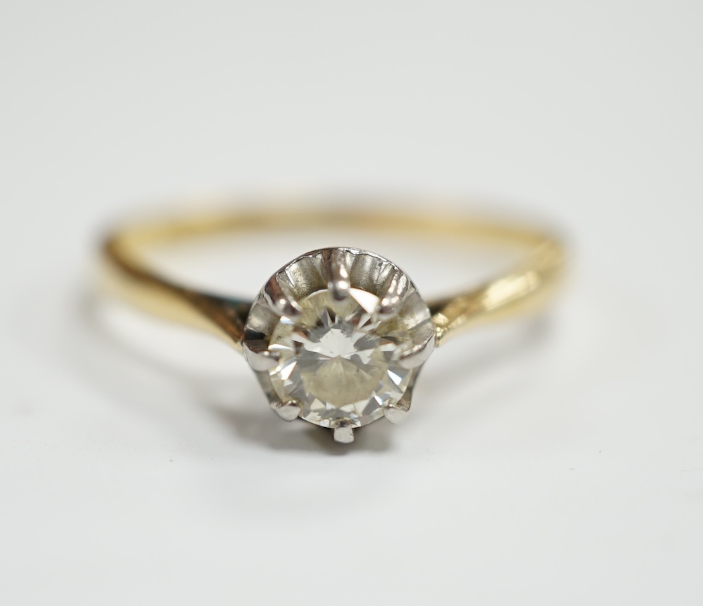 An early 20th century 18ct, plat and claw set solitaire diamond ring, size S, gross weight 2.8