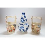 A Chinese blue and white double gourd vase and two Japanese Satsuma baskets, tallest 16cm