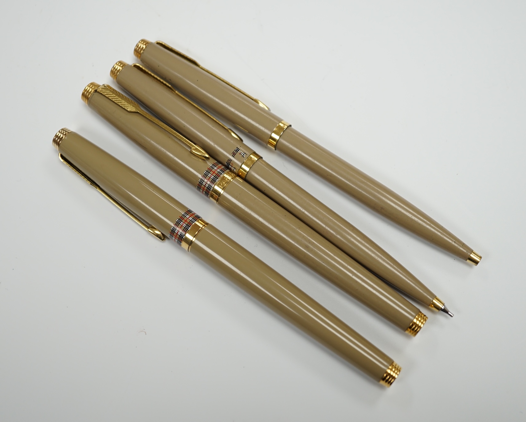 Parker for Burberry - a pair of fountain pens, a ballpoint pen and pencil in box, the vendor being