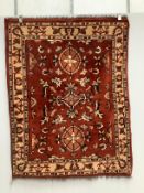 Two Turkish red ground rugs, larger 156 x 130cm