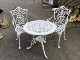 A Victorian style painted aluminium circular garden table, diameter 68cm, height 65cm together