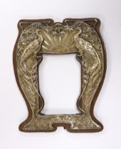An Edwardian Art Nouveau repousse silver mounted photograph frame, decorated with peacocks, Henry