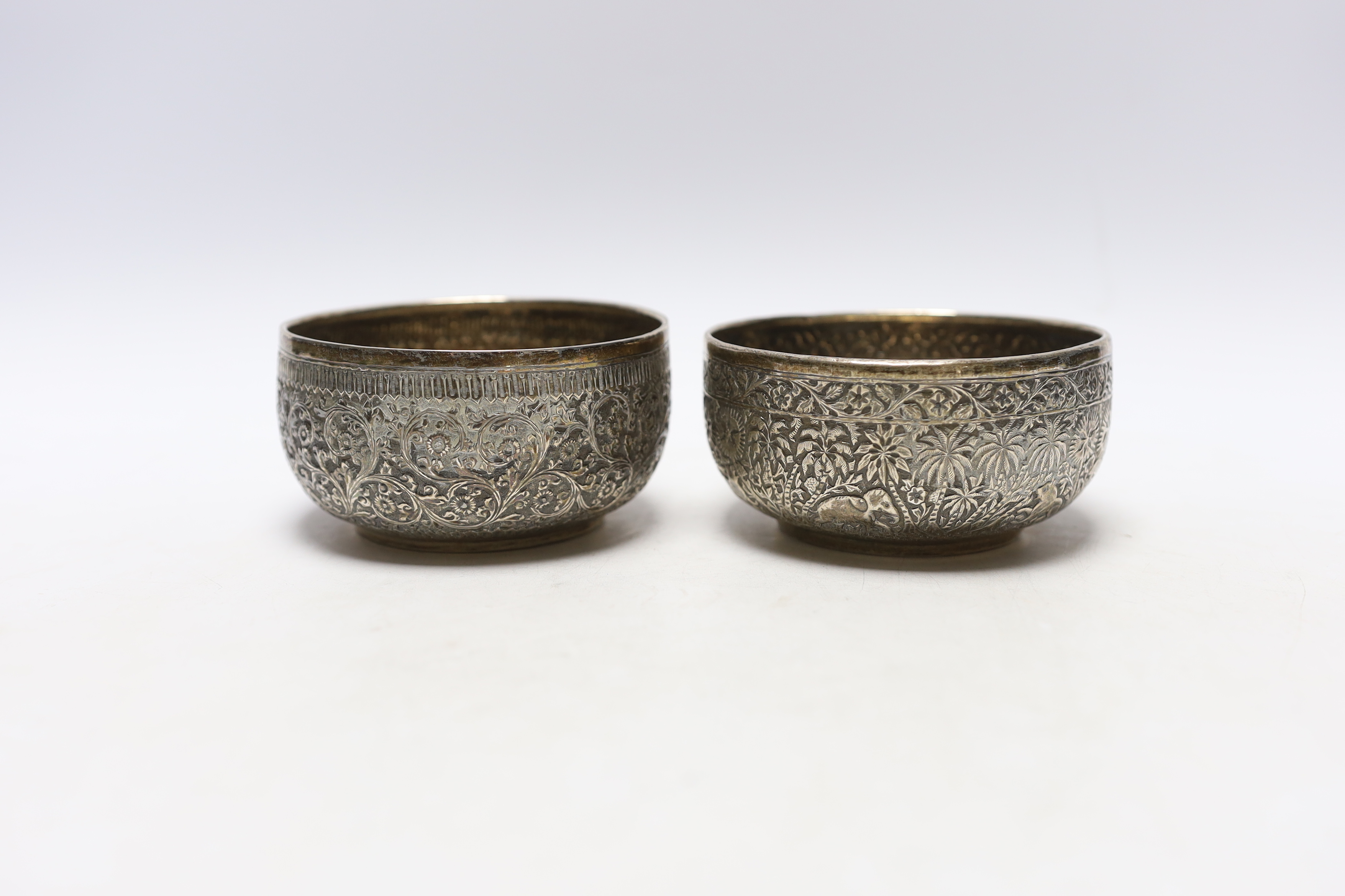 A pair of Indian embossed white metal finger bowls, 10cm, 7.5oz.