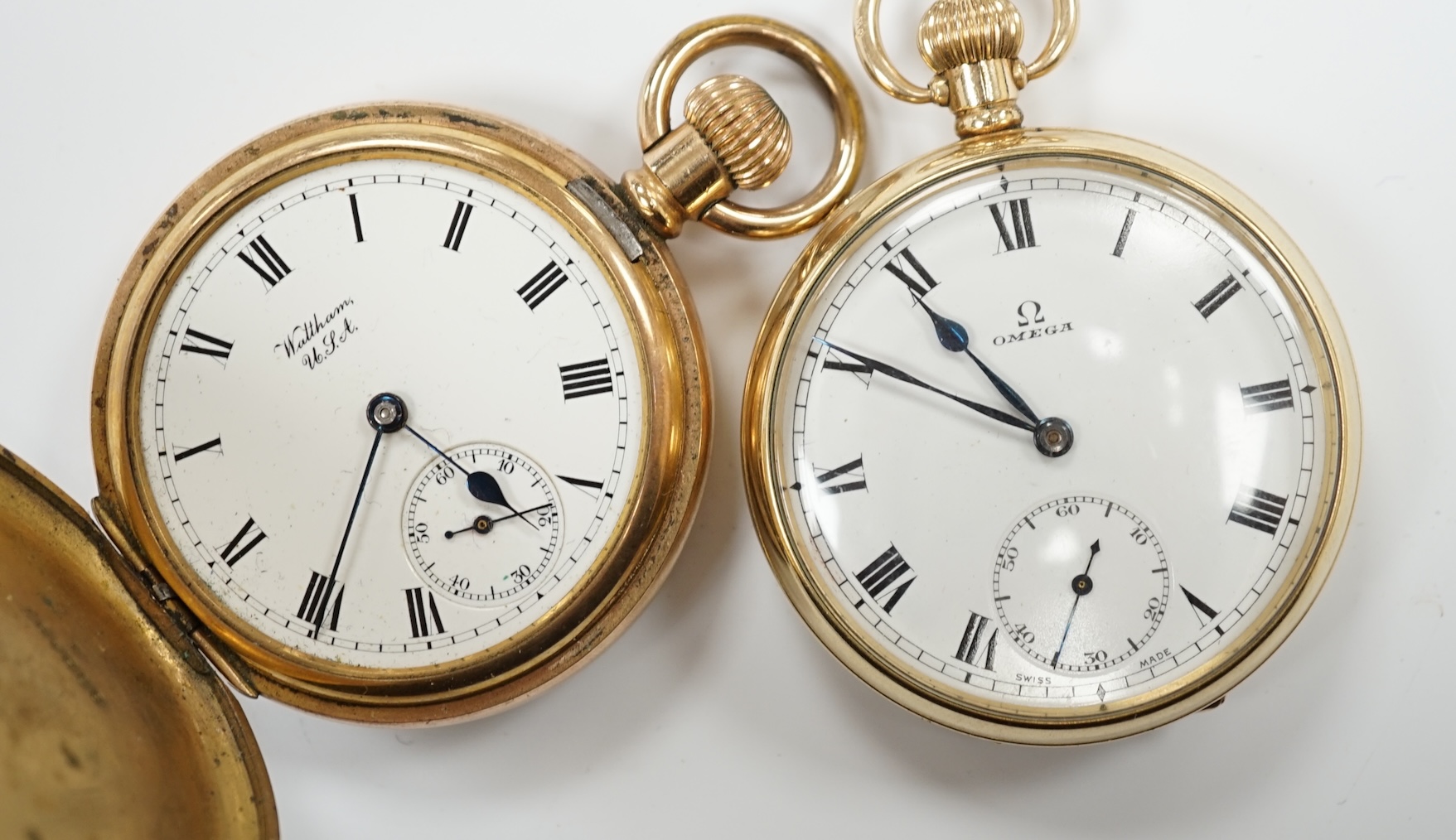 A gold plated Omega open faced pocket watch, with Roman dial and subsidiary seconds and a gold