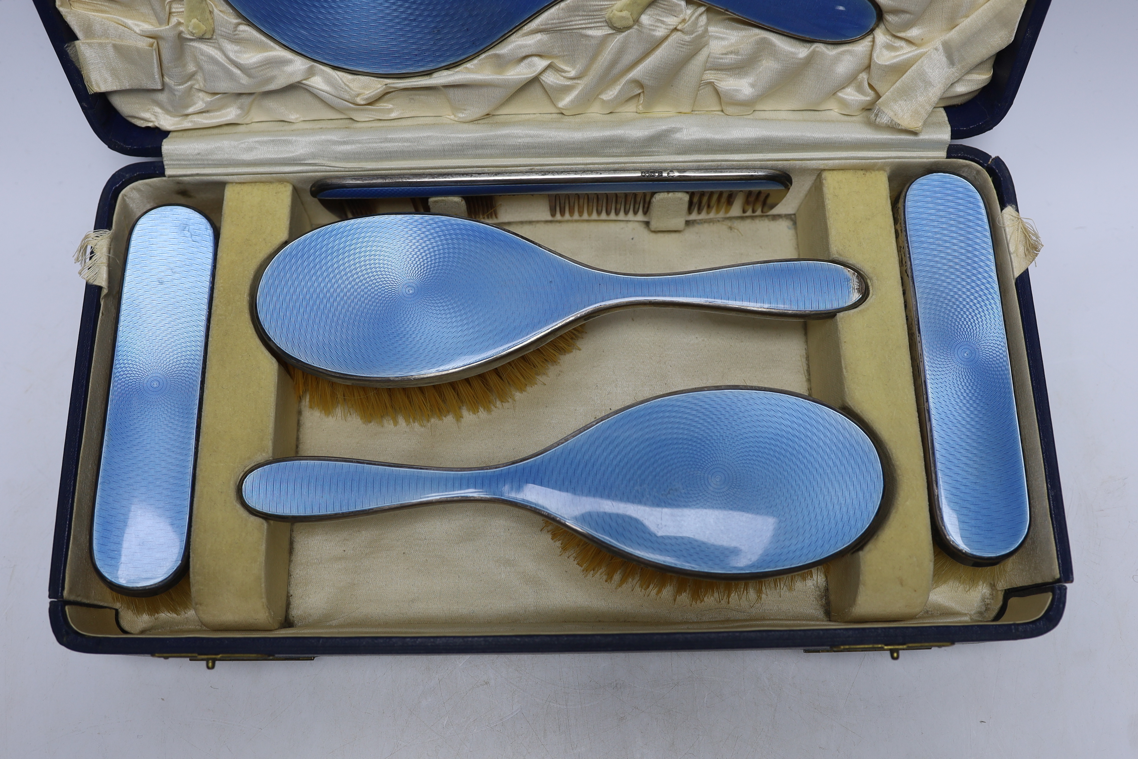 A cased George V silver and blue guilloche enamel mounted six piece mirror and brush set, Charles - Image 3 of 4