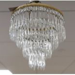 A pair of cut glass four tier chandeliers, 35cm long