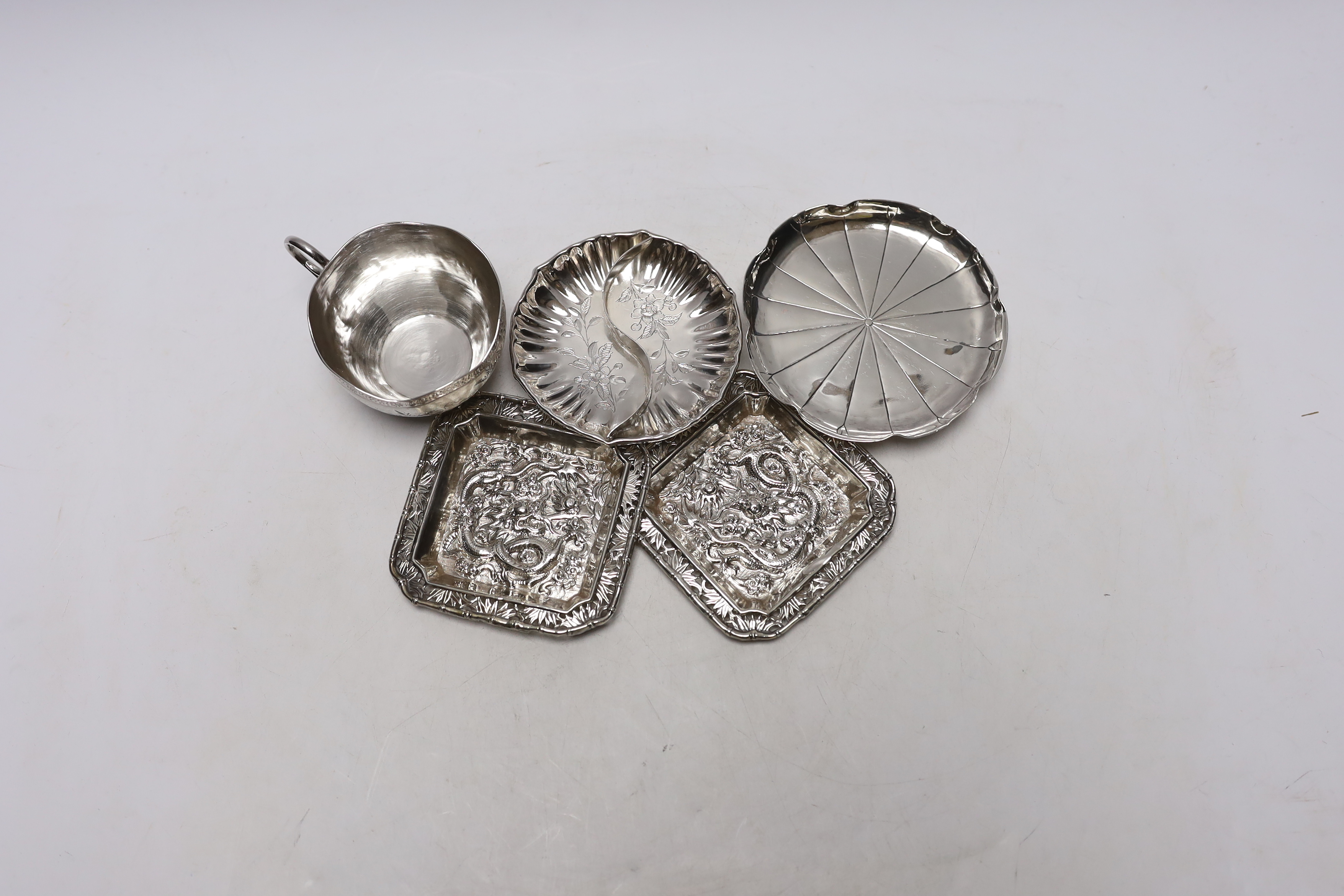 Chinese white metal items including two shaped dishes, a tea cup and two dragon dishes, largest 10. - Image 2 of 4