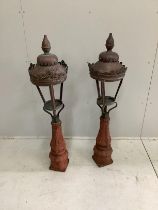 A pair of Victorian copper and cast iron lamps, height 122cm