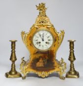 A late 19th century French Vernis Martin ormolu mounted clock with key and pendulum and a pair of