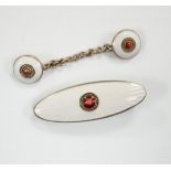 An early 20th century Russian 84 zolotnik and two colour enamel tie clip, 33mm and cloak clasp.