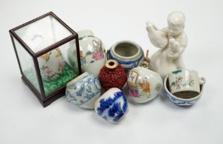 A group of small Chinese bowls, a blanc de chine figure, a cinnabar lacquer miniature vase, etc.