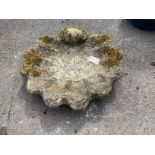 A reconstituted stone scallop shell bird bath, (missing column) width 55cm