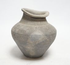 A Chinese grey pottery ribbed jar, probably Han dynasty, 19cm high