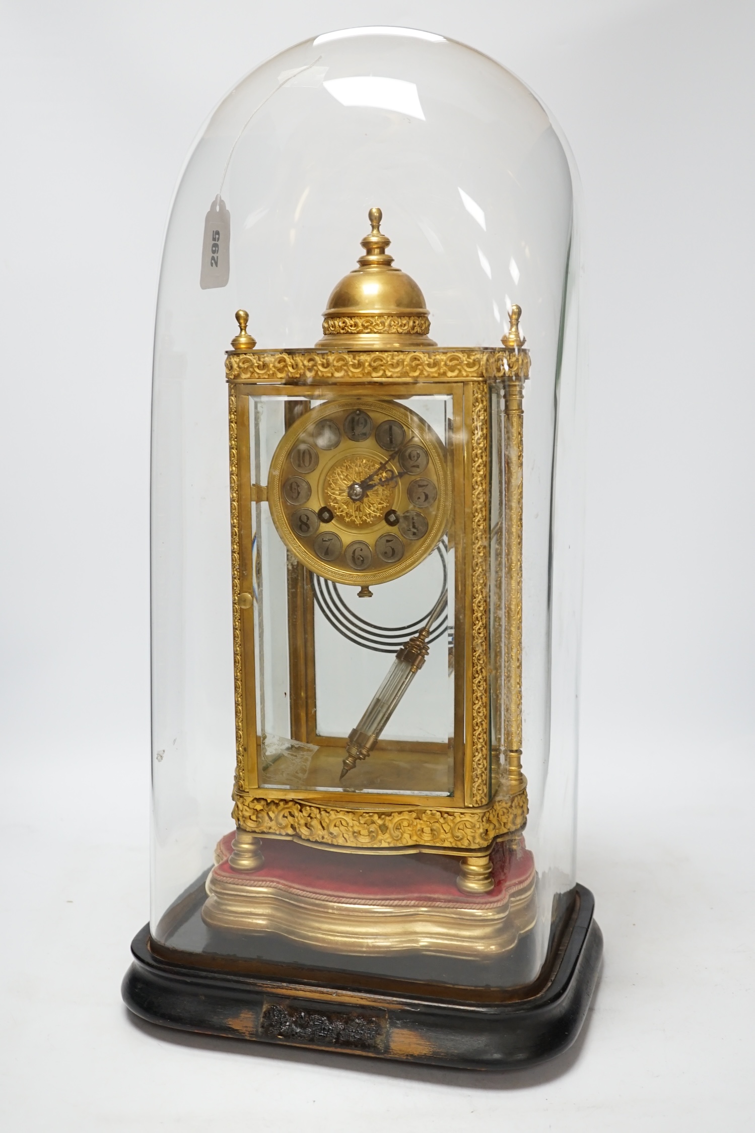 A French four glass mantel clock striking on a coiled gong with gilt brass frame and mercury