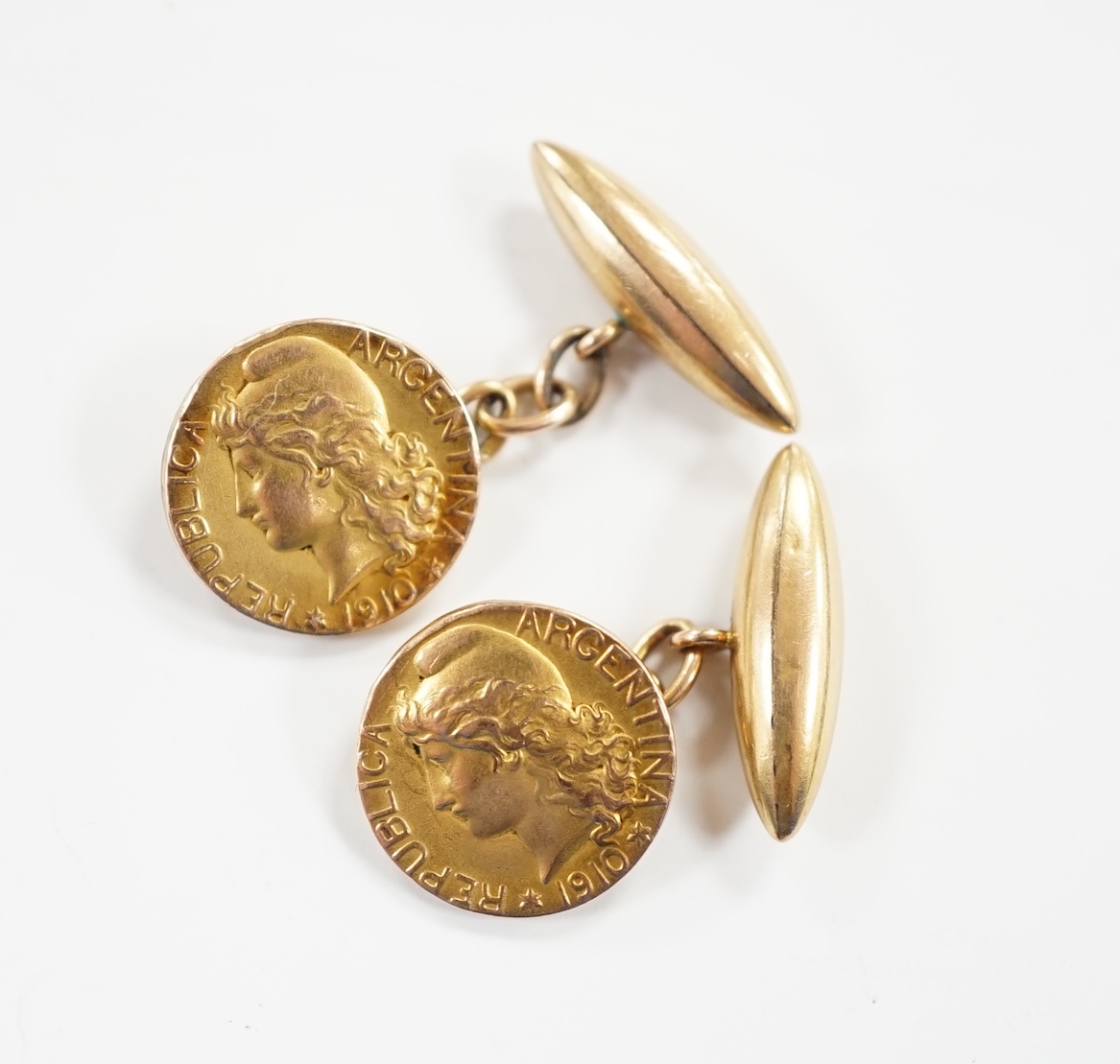 A pair of Argentinian yellow metal? commemorative coin cufflinks, 13mm., Total weight 4.2g