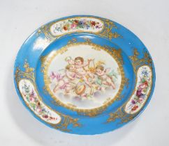 A Sevres style dish decorated with amorini, 33cm