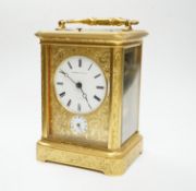 A late 19th century engraved brass cased repeating alarm carriage clock, with Russian retailer,