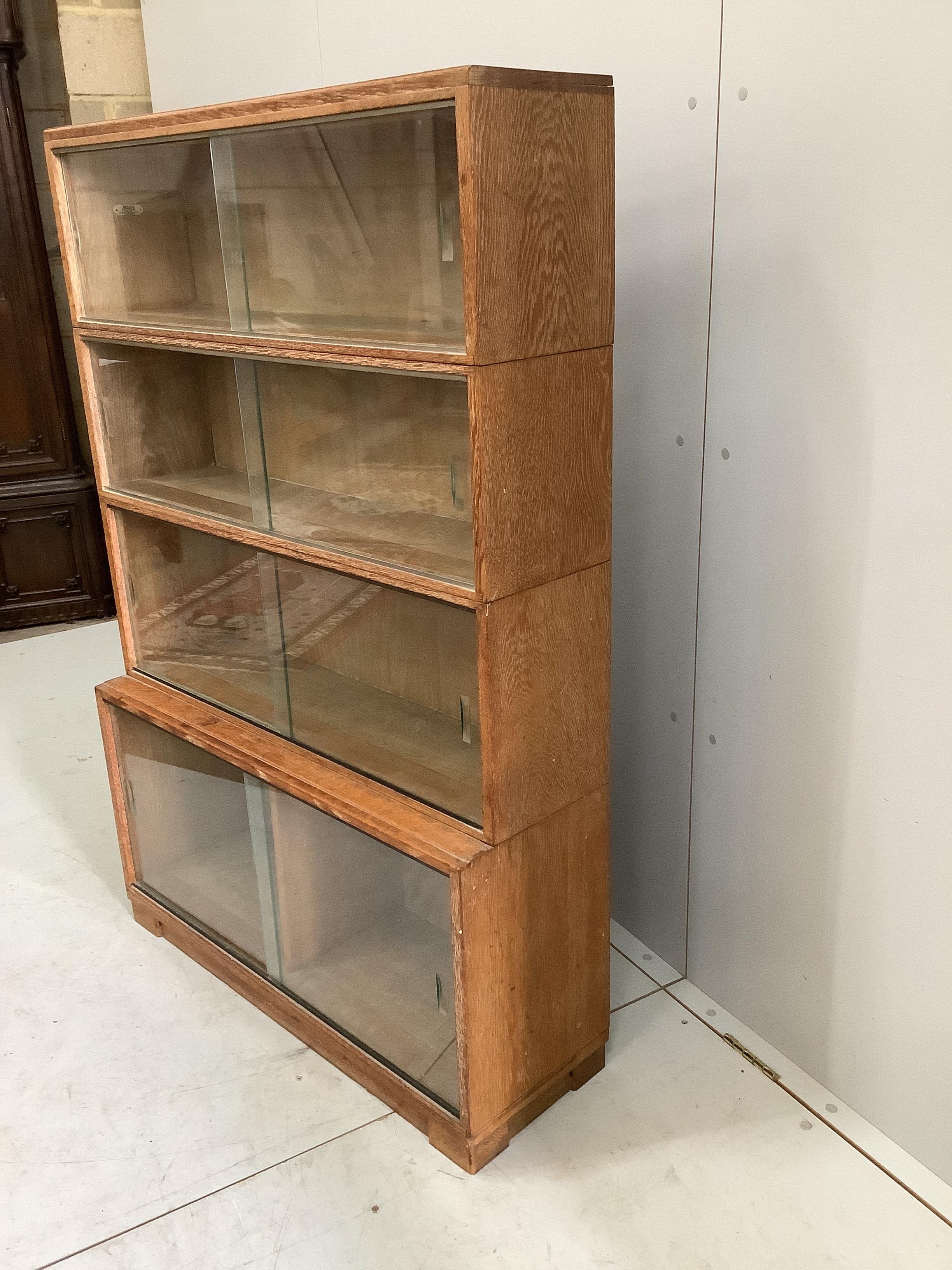 A Minty four section oak glazed bookcase, width 89cm, depth 30cm, height 134cm - Image 3 of 3
