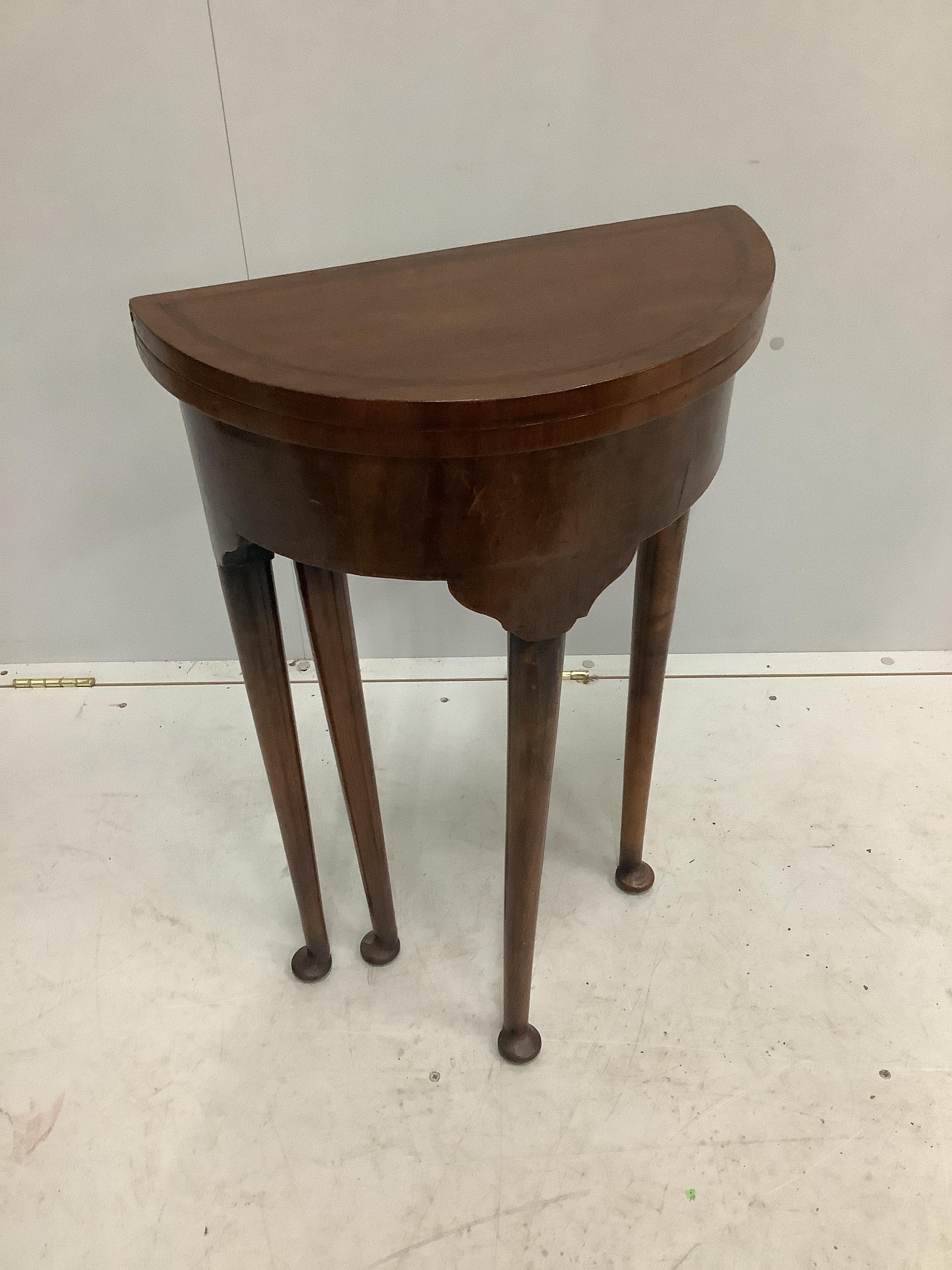 A small reproduction George III style circular topped mahogany D shaped folding table, diameter