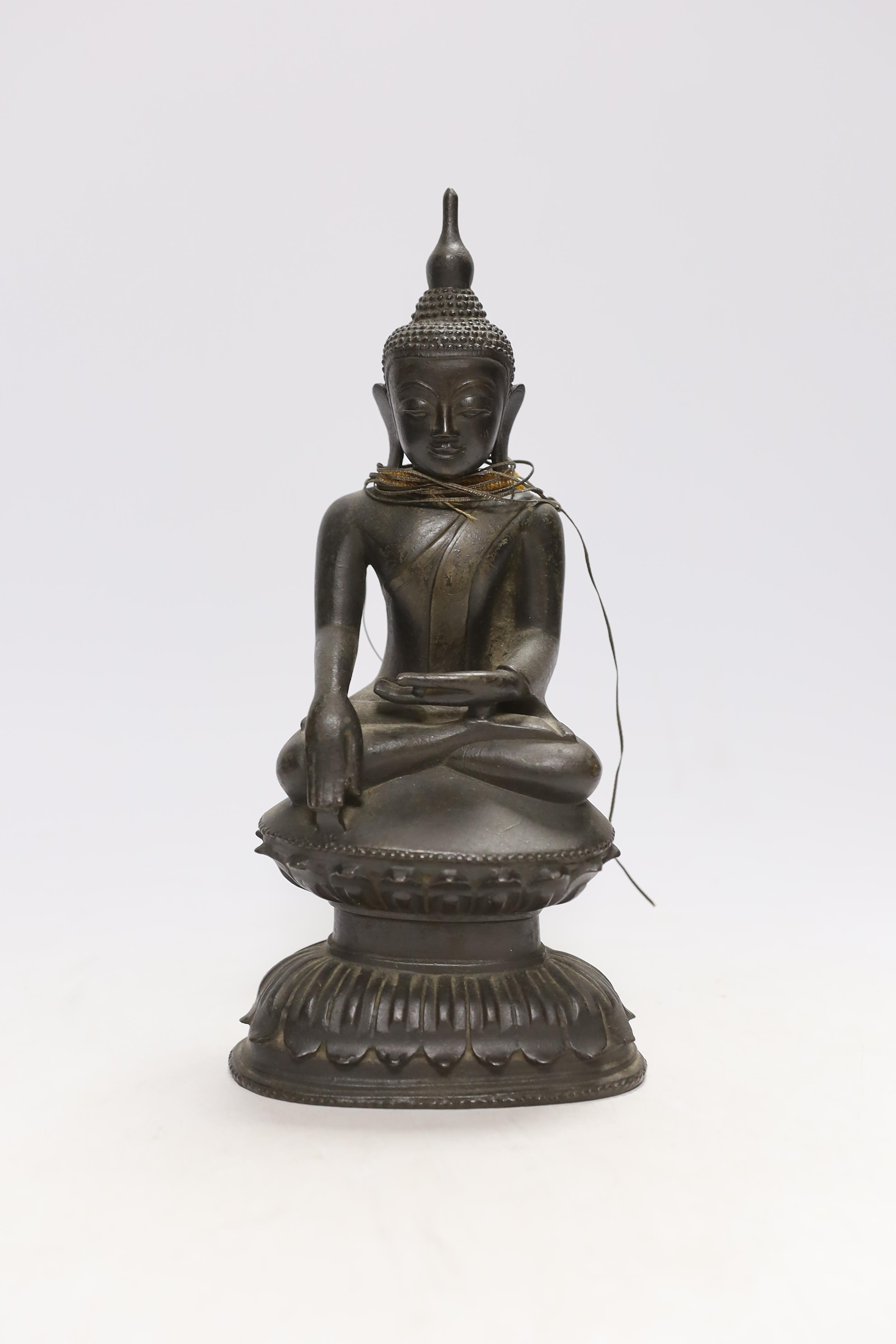 A 19th century Burmese bronze figure of Buddha, 26cm high