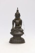 A 19th century Burmese bronze figure of Buddha, 26cm high