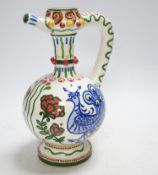 A Zsolnay jug or ewer decorated with peacocks and flowers, stamped ‘Zsolnay 830 and 07’ to the base,