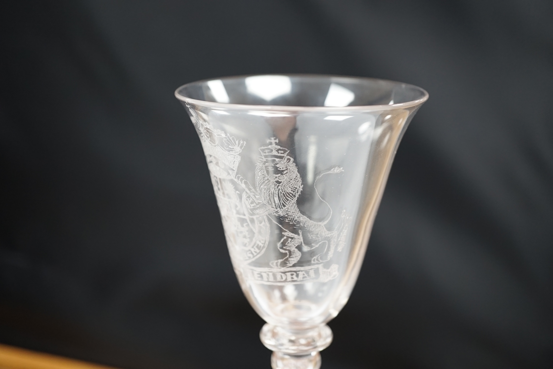 An 19th century diamond point engraved armorial glass, with knopped stem, air tears and rough - Image 4 of 5