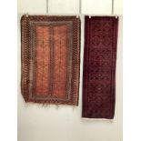 A Belouch red ground rug and a runner, larger 155 x 106cm