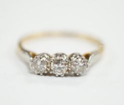 An 18ct, plat and three stone diamond set ring, size P/Q, size 2.6 grams.