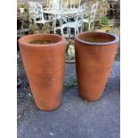 A pair of tall circular terracotta garden planters, diameter 38cm, height 71cm