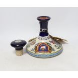 A commemorative ceramic decanter for HMS victory at the Battle of Trafalgar 1805, containing British