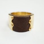 An Israeli? 14k and leather inset band, size N/O, gross weight 15.8 grams.