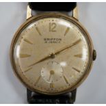 A gentleman's Swiss 9ct gold Griffon manual wind wrist watch, on a leather strap.