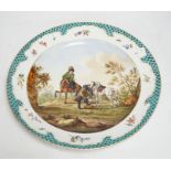 A Meissen style dish decorated with a hunting party, 35.5cm diameter