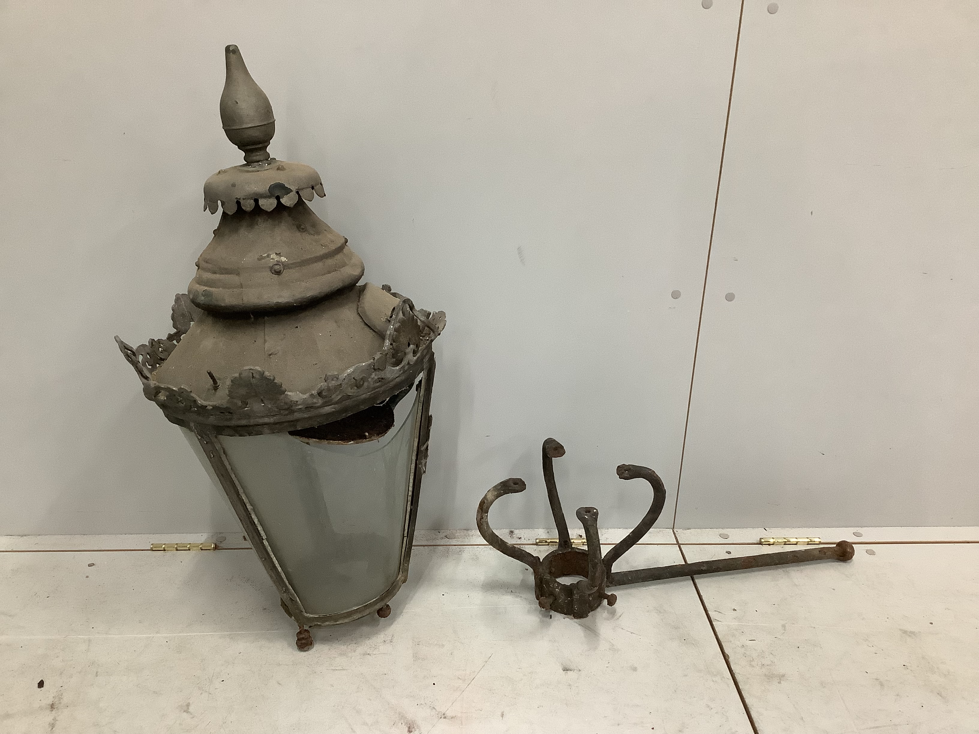 A Victorian copper lantern with bracket and spare glass section, height 80cm