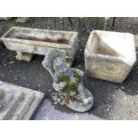 Two reconstituted stone trough garden planters and a seated gnome garden ornament, largest width