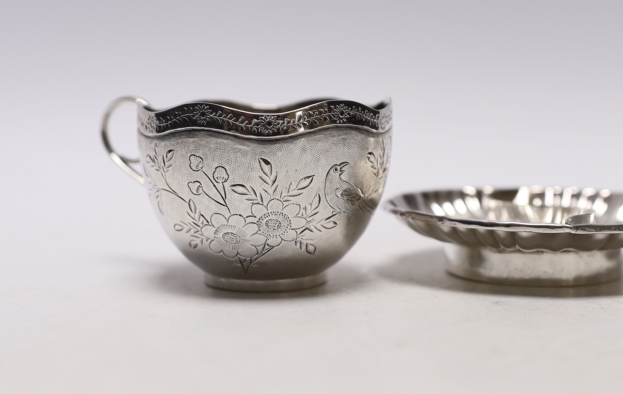 Chinese white metal items including two shaped dishes, a tea cup and two dragon dishes, largest 10. - Image 3 of 4