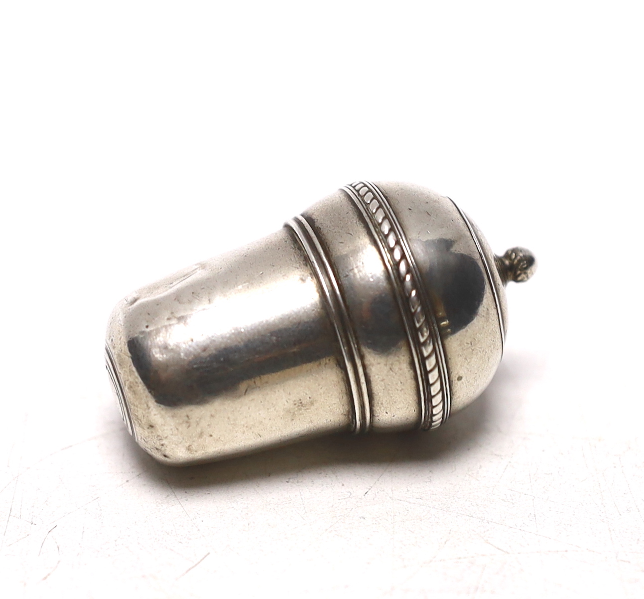 A continental white metal nutmeg grater?, modelled as an acorn, lacking rasp, makers mark to lid