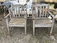 A pair of Pagoda Furniture weathered teak garden armchairs, width 60cm, depth 59cm, height 83cm