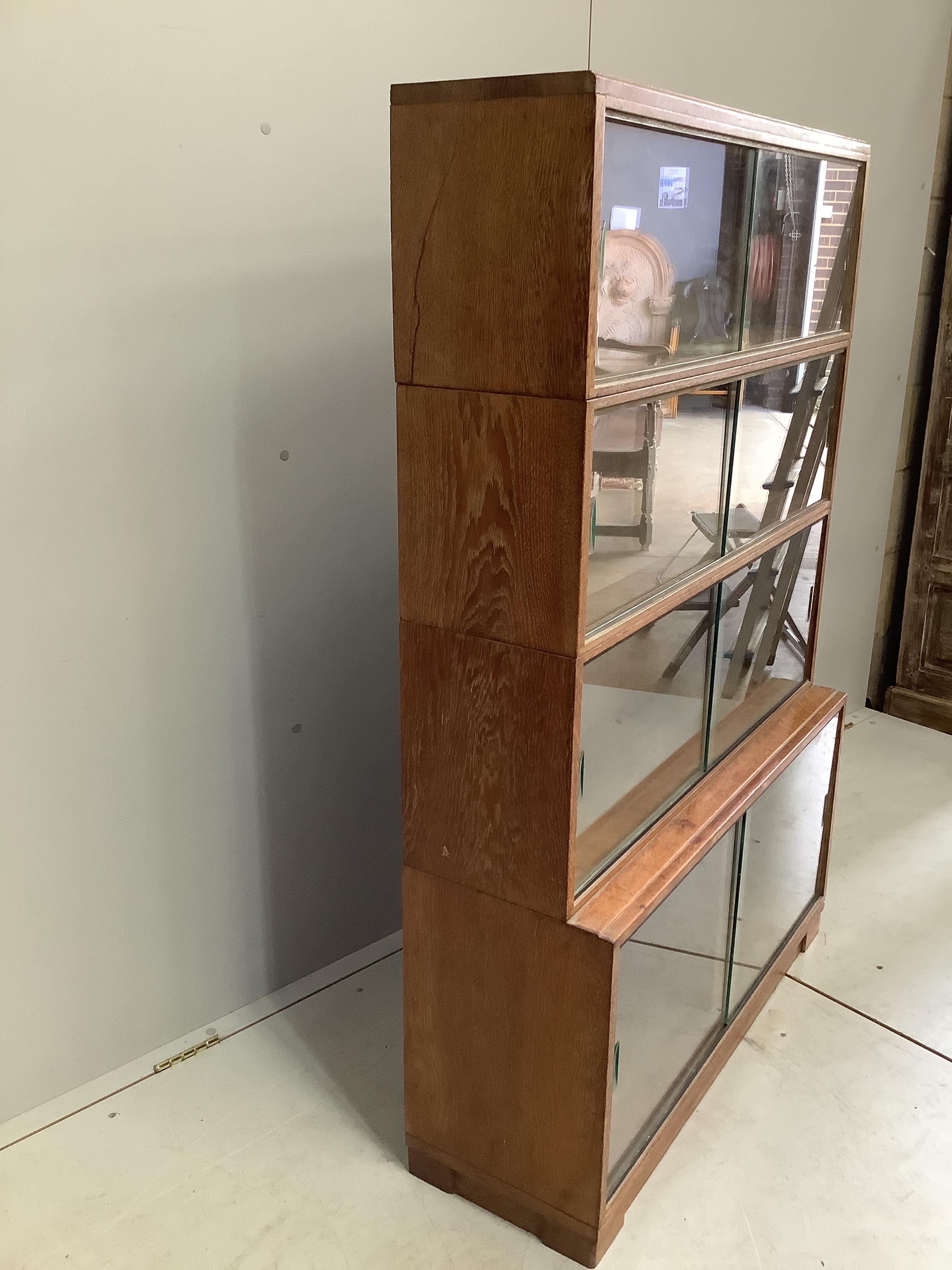 A Minty four section oak glazed bookcase, width 89cm, depth 30cm, height 134cm - Image 2 of 3