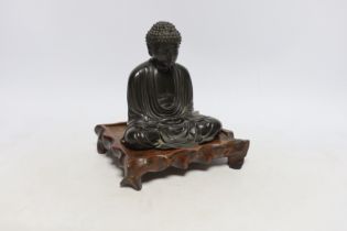 A Japanese bronze figure of Buddha, Meiji period, inscribed seven character mark to base, on a