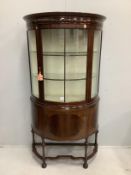 An Edwardian mahogany bow fronted glazed china display cabinet, with cupboard under, width 97cm,